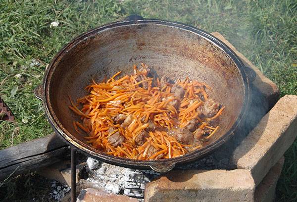 Cooking in a cauldron in the nature