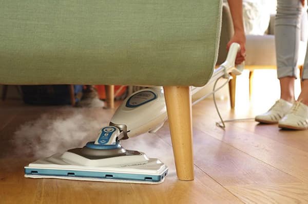 Laminate washing with a steam mop