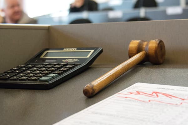 A calculator and a hammer at auction